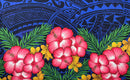 Hibiscus, Plumeria Assortment Sarong (Style 7) featuring a vibrant Polynesian-inspired design. The pattern includes several large, bright pink hibiscus flowers with detailed petals and yellow-orange plumeria blossoms set against a background of lush green palm fronds. The top half of the design features a deep blue background with intricate, traditional Polynesian tribal motifs and tattoo-inspired geometric patterns.