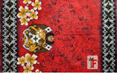A red fabric or textile panel featuring a tropical monstera leaf pattern, white and yellow plumeria flowers, a central crest with a white cross, and black-and-white geometric borders on both sides.