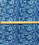 A yard of polyester fabric with a traditional Polynesian tattoo design, featuring small hibiscus flowers and geometric patterns in a repeating motif on a purple background.