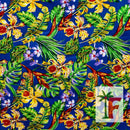 Tropical Hawaiian orchid print fabric in Moana Royal blue with yellow florals and lush green palm leaves.