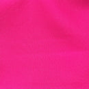 Solid hot pink rayon challis fabric draped in soft, spiral folds. 