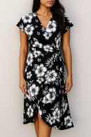 Tropical Hibiscus Cluster Rayon Challis Fabric in black and white, styled as a summer wrap dress.