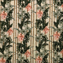 A vintage-inspired tropical fabric pattern featuring pink and peach lilies, lush green palm fronds, and monstera leaves arranged against a backdrop of vertical bamboo-style stripes on a cream-colored base.